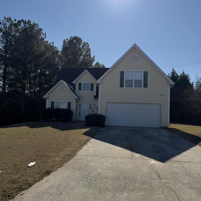 3-tab shingle roof with tarp over leak area