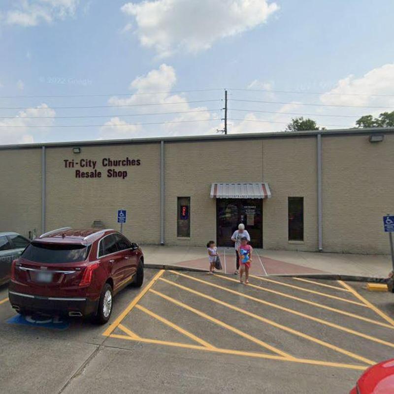 Commercial building exterior with paved parking lot