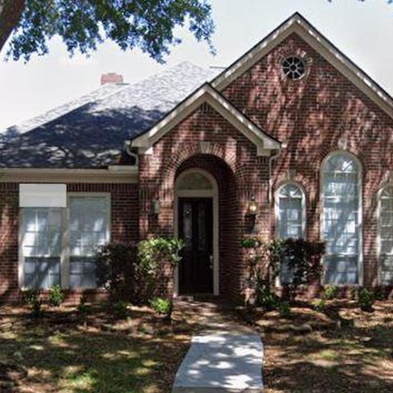 Roof shingles inspection on brick residential home in Katy, TX