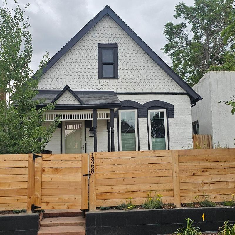 Wooden privacy fence installation in front yard Wooden privacy fence installation in front yard