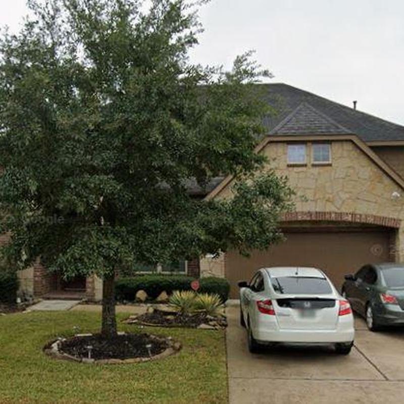 Roof shingles inspection on suburban home driveway