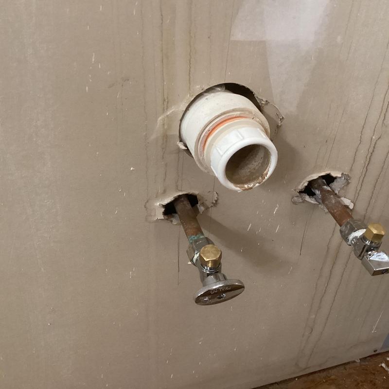 Bathroom vanity shut off valves with caps installed