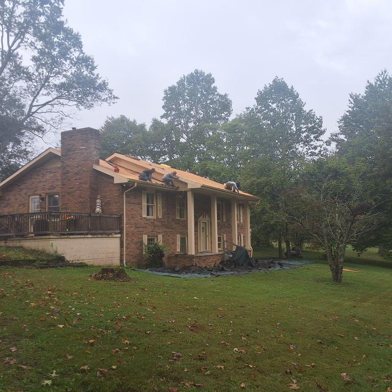 Roof decking replacement on two-story brick house