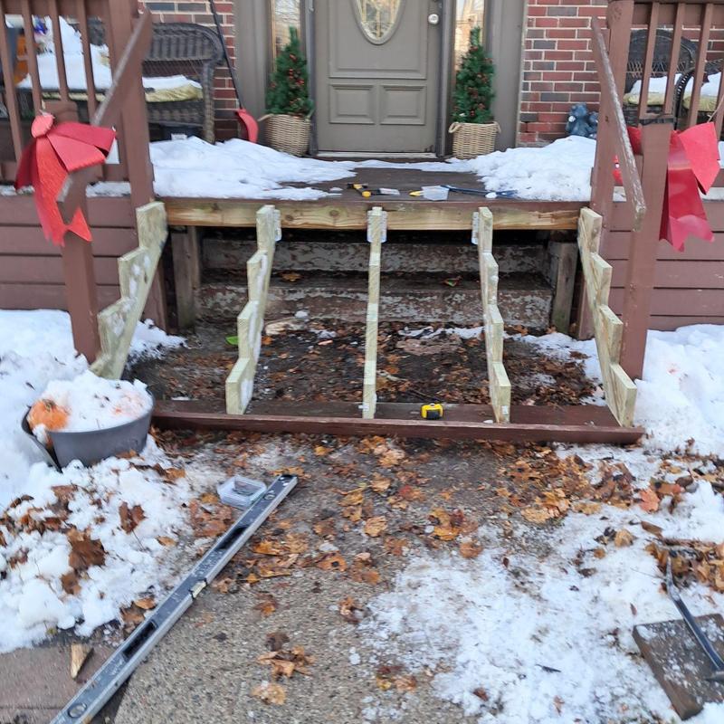 Exterior deck stair frame under construction in winter Exterior deck stair frame under construction in winter