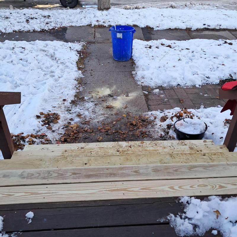 Exterior deck stair run with new wooden planks in snow Exterior deck stair run with new wooden planks in snow