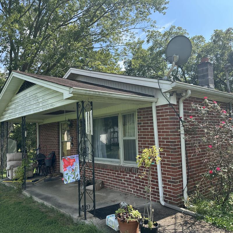 Black Shadow shingle roof and chimney on brick house