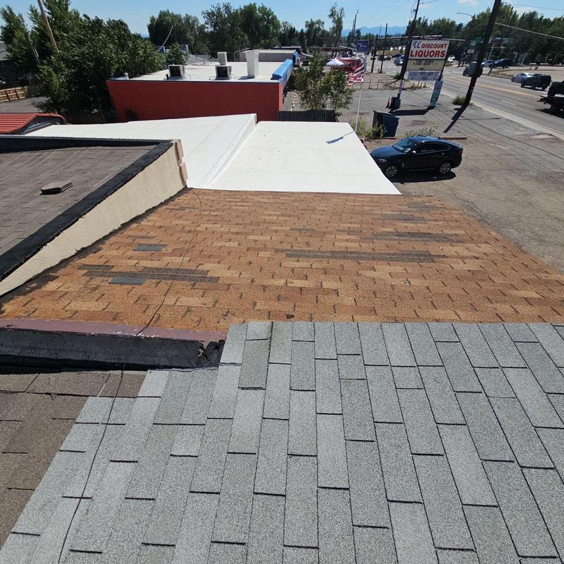 Asphalt shingle roof layers with visible wear and cracking Asphalt shingle roof layers with visible wear and cracking