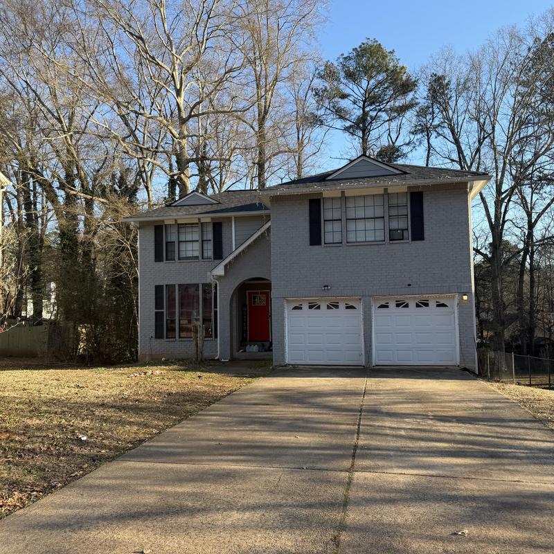 Bathroom leak above driveway in three-story house