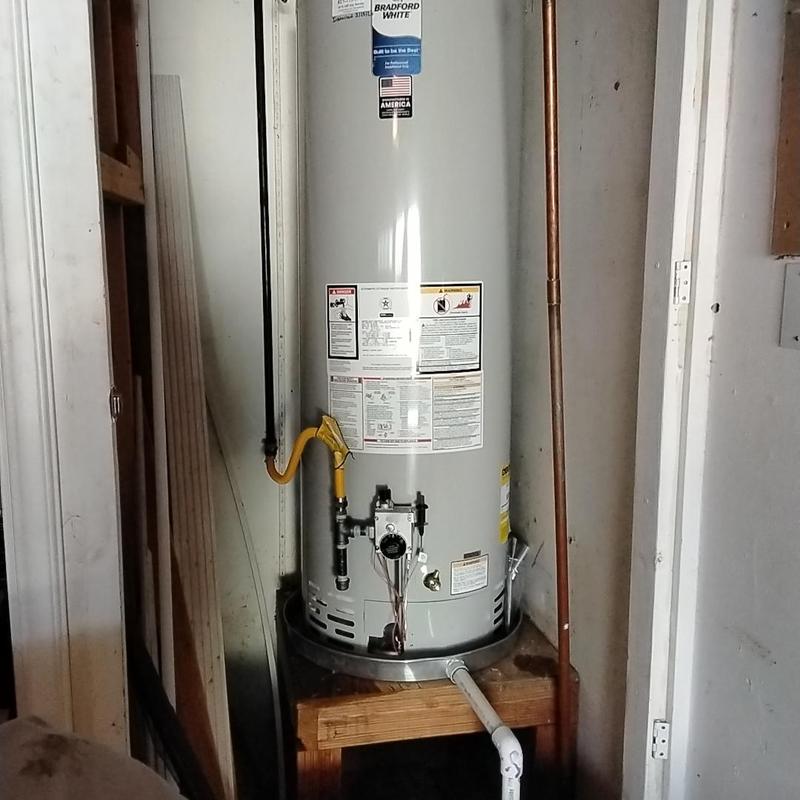 50 gallon gas water heater with plumbing upgrades in garage