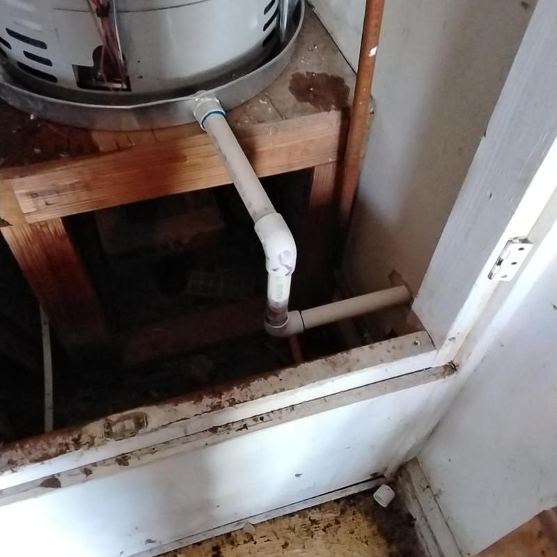 50-gallon gas water heater drain pipe and plumbing installation