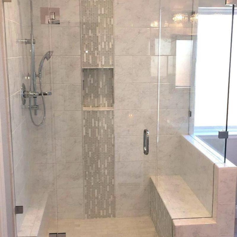 Frameless glass master shower with tile bench