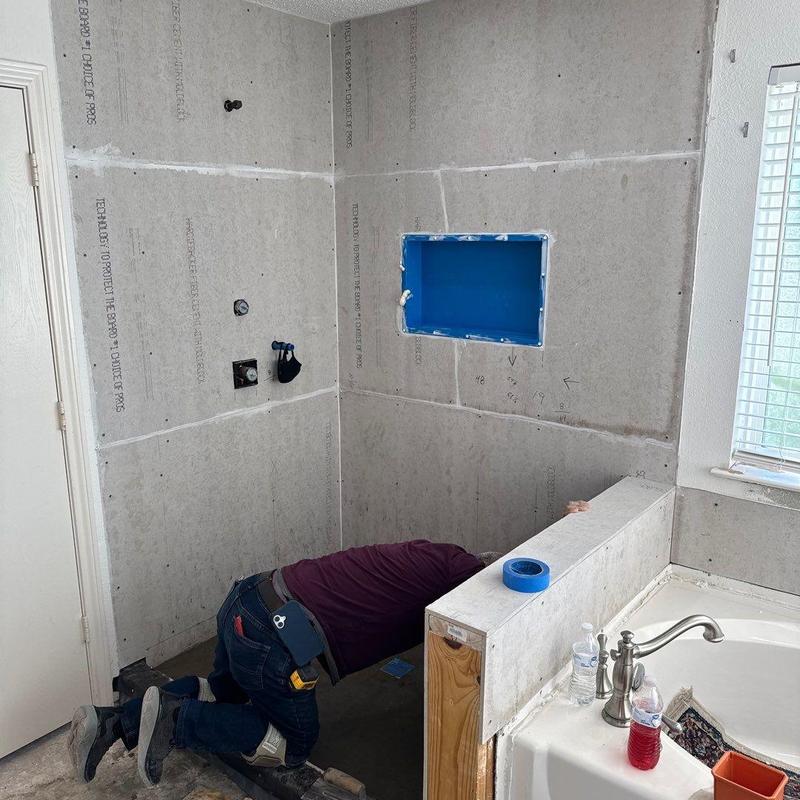 Shower wall installation in master bathroom remodel