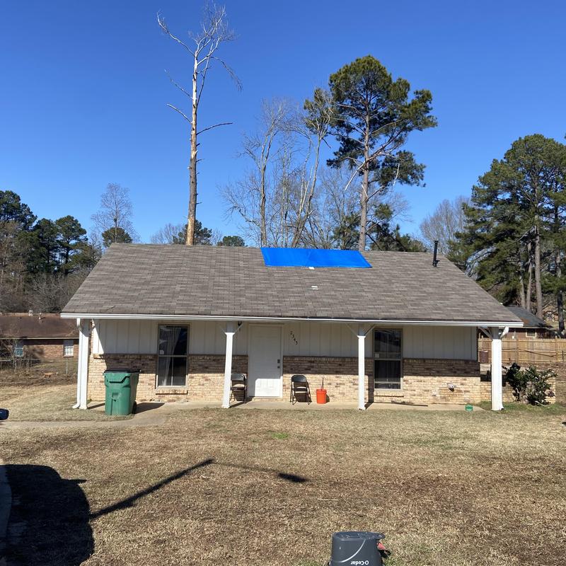 Roof tarp installation over tree damage inspection Roof tarp installation over tree damage inspection