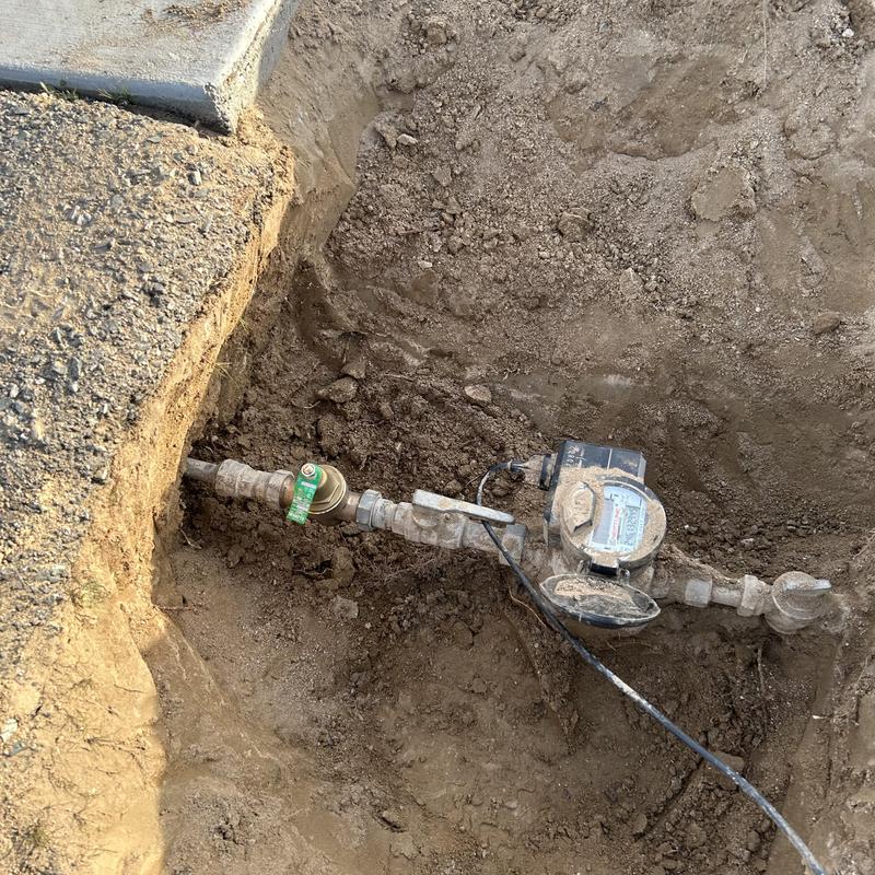 Water meter and galvanized pipe excavation site