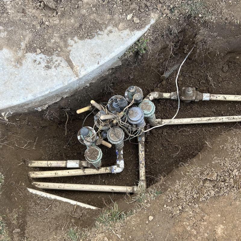 Irrigation valve system with connected piping underground