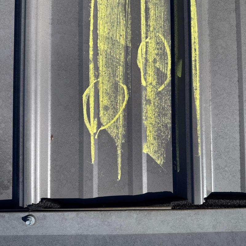 Metal roofing panel with chalk markings for inspection