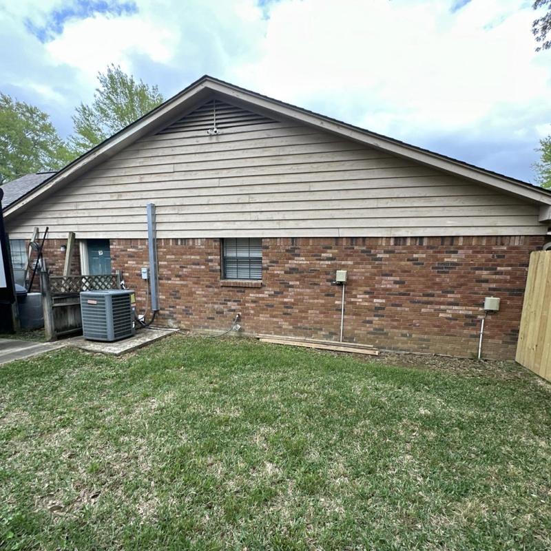 Roof siding inspection on brick and wood panels Roof siding inspection on brick and wood panels