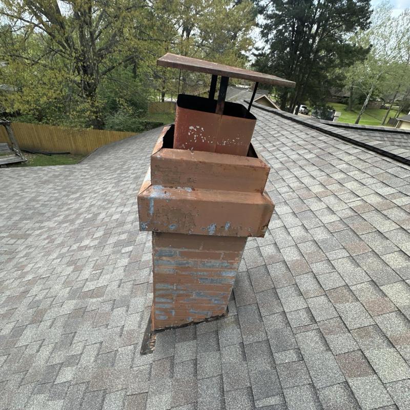 Metal chimney cap on asphalt shingle roof inspection Metal chimney cap on asphalt shingle roof inspection