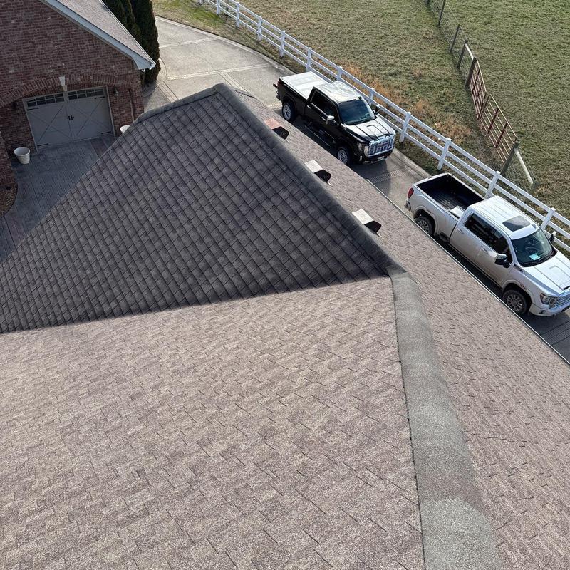 Asphalt shingle roof with hail damage and vent pipes