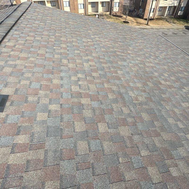 Asphalt shingle roof with hail damage inspection