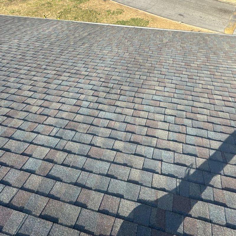 Asphalt shingle roof with hail damage inspection