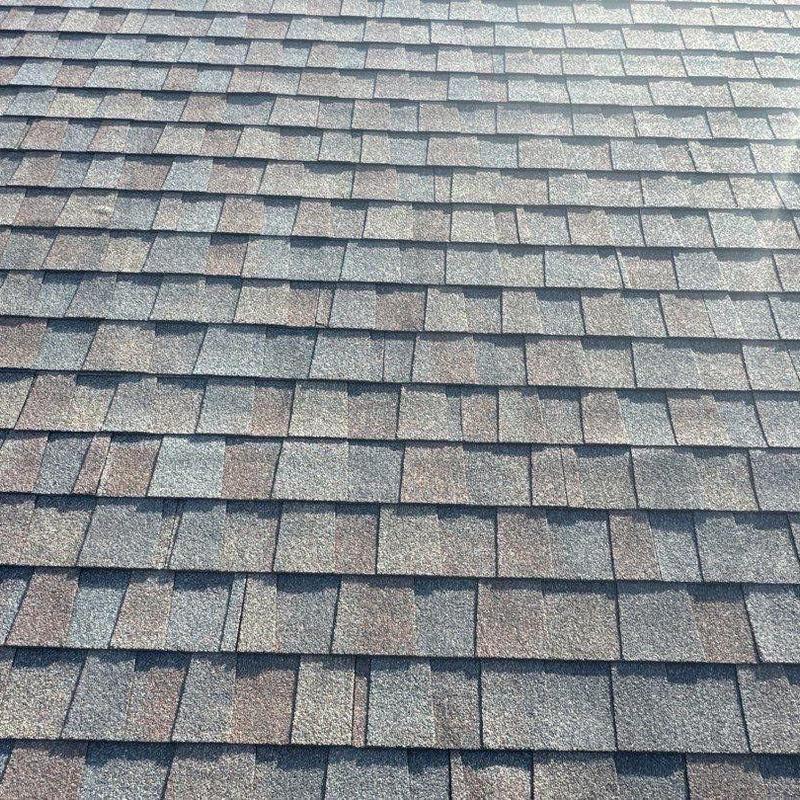 Asphalt shingle roof with hail damage inspection