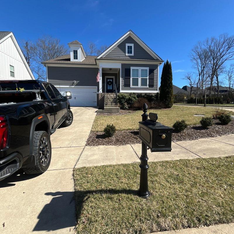 Mailbox and driveway area in residential front yard