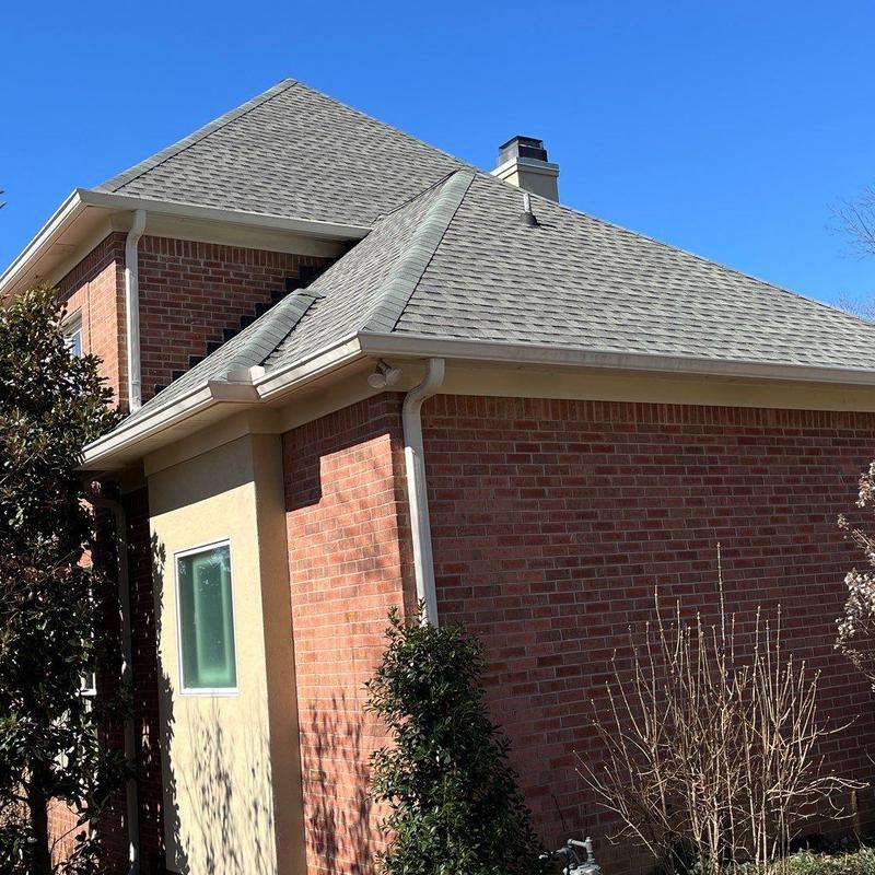 Asphalt shingle roof with hail damage and drainage system