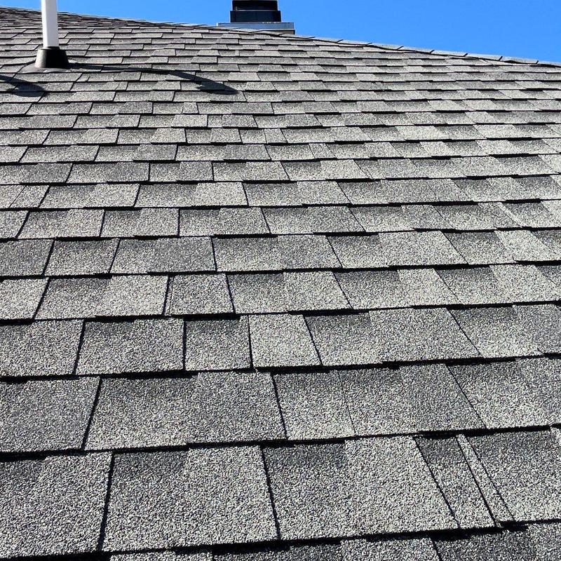 Asphalt shingle roof with hail damage inspection