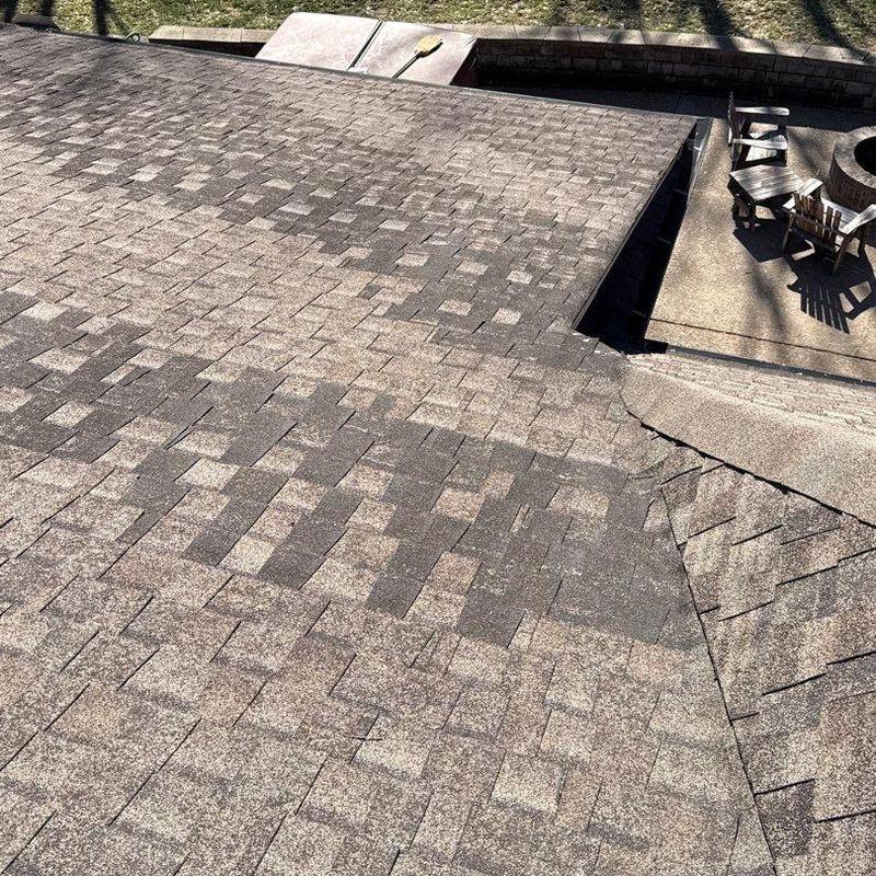 Asphalt shingle roof with hail damage inspection