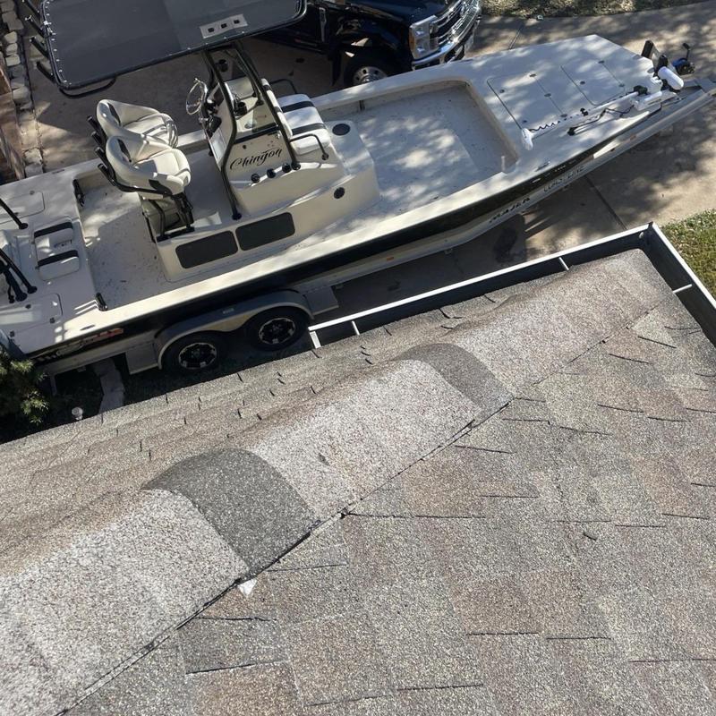 Architectural asphalt shingles on roof ridge repair