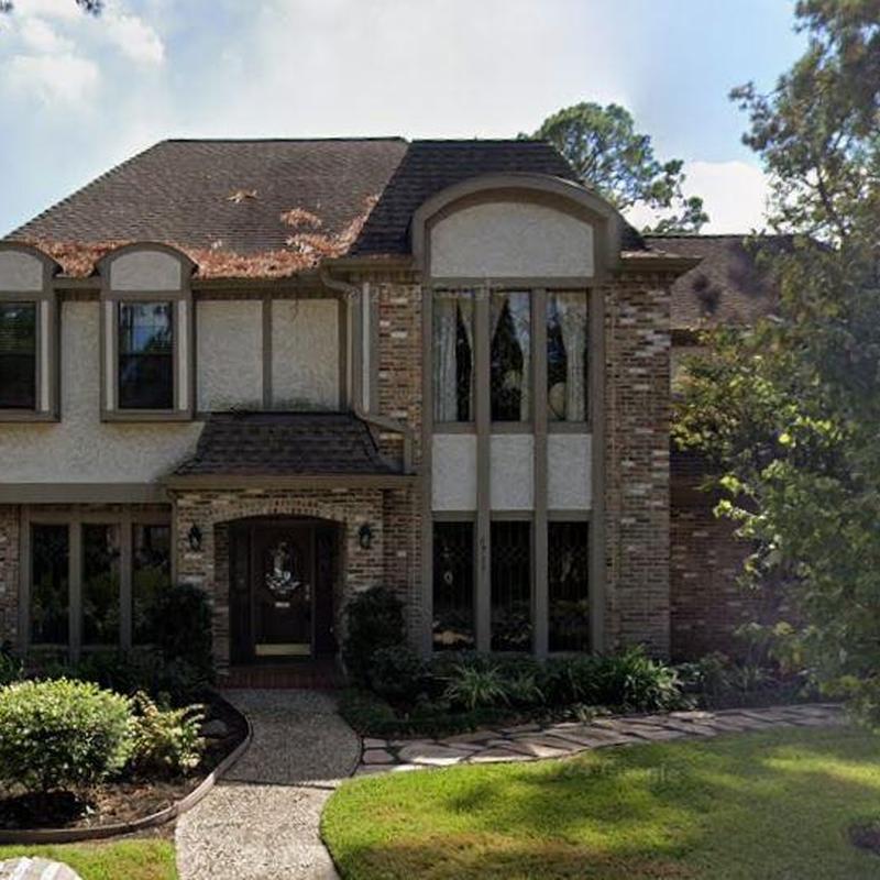Roof shingles with leaf debris on residential home in Katy TX