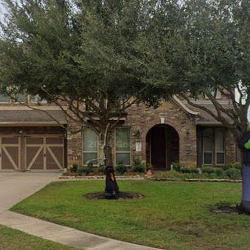 Roof and gutter system inspection at suburban home