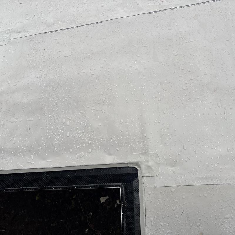 Flat roof membrane with new chimney flashing and gutter guards