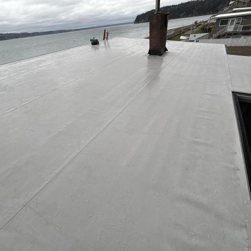 Flat roofing system with chimney flashings and gutter guards