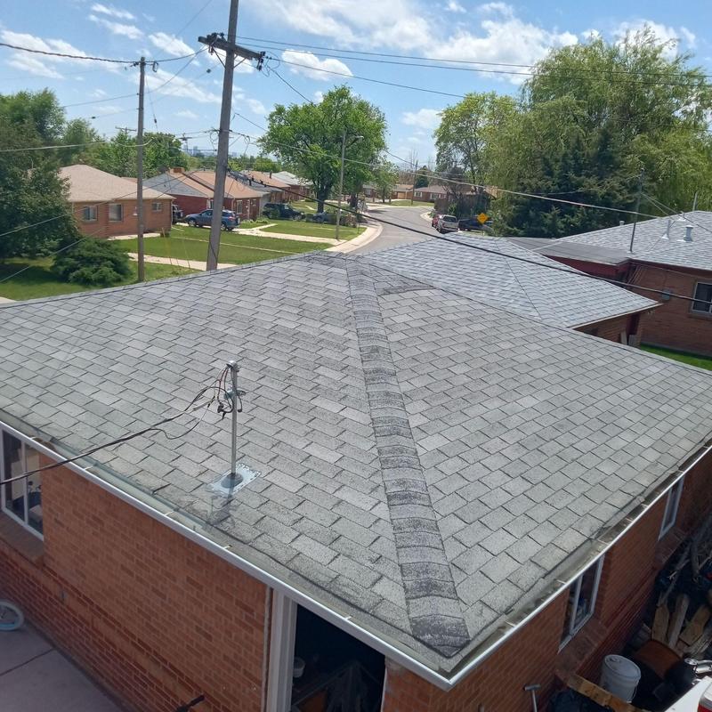 3-tab shingle roof with visible wear and ridge cap 3-tab shingle roof with visible wear and ridge cap