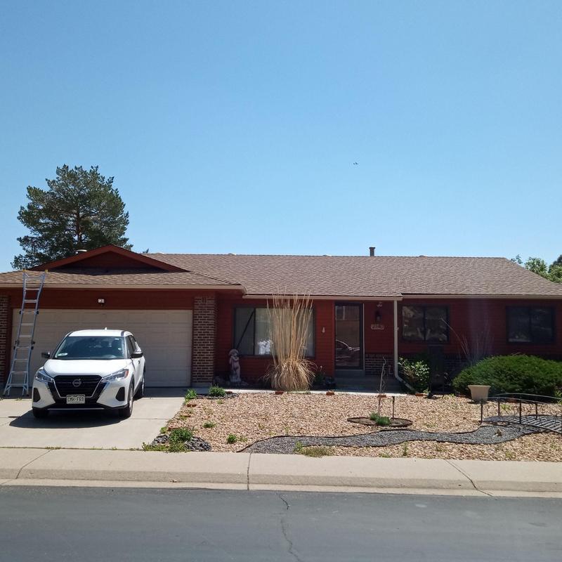 Roof shingles with hail damage on residential home Roof shingles with hail damage on residential home