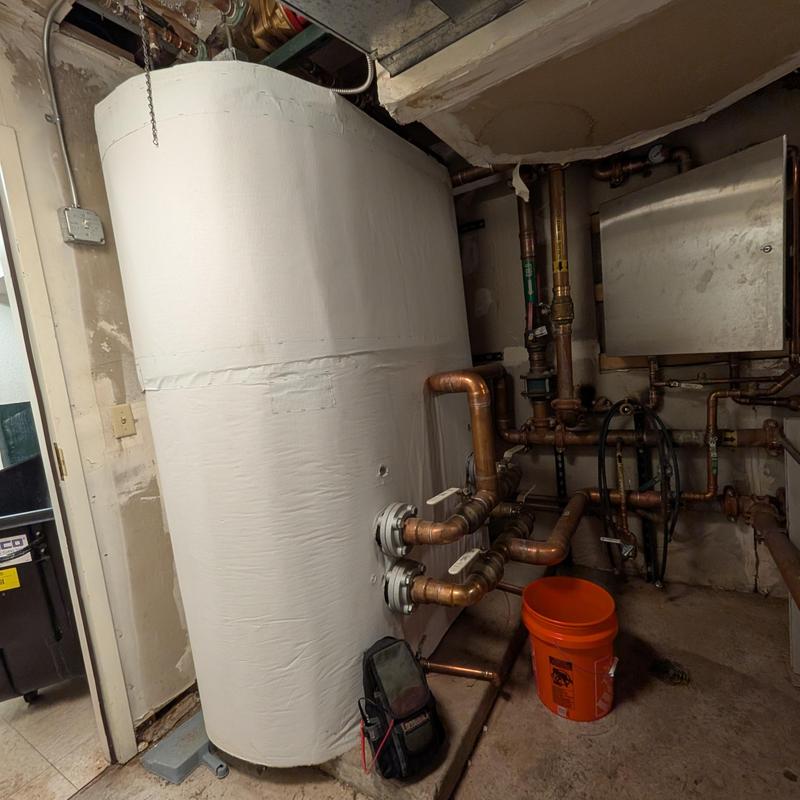 Hot water generator with copper piping and valve adjustments