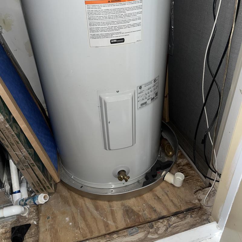 Electric water heater with thermostat access panel
