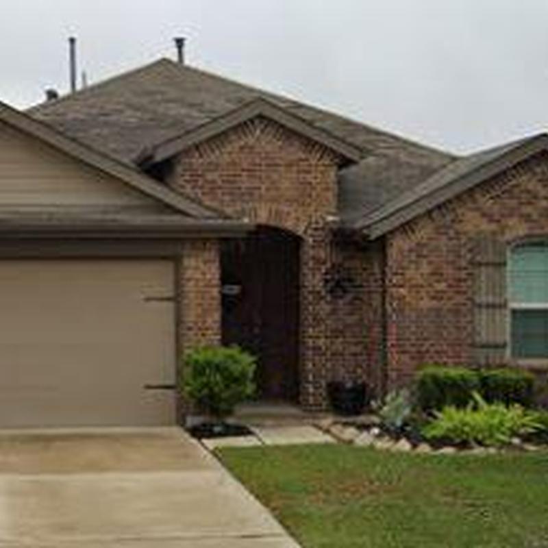 Asphalt shingle roof with brick exterior and landscaping
