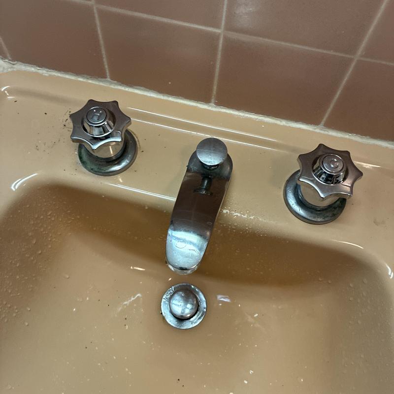 Three-handle basin faucet with valve stems replaced