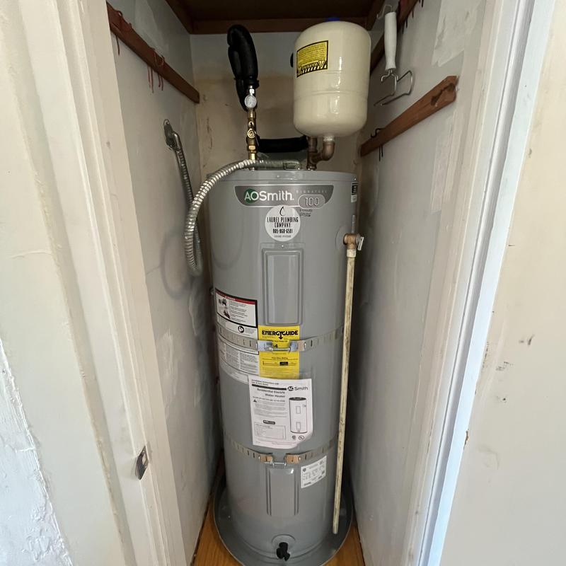 Electric water heater with expansion tank installed