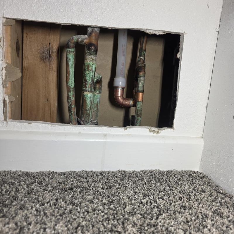 Hot water line reroute with copper and PEX pipes