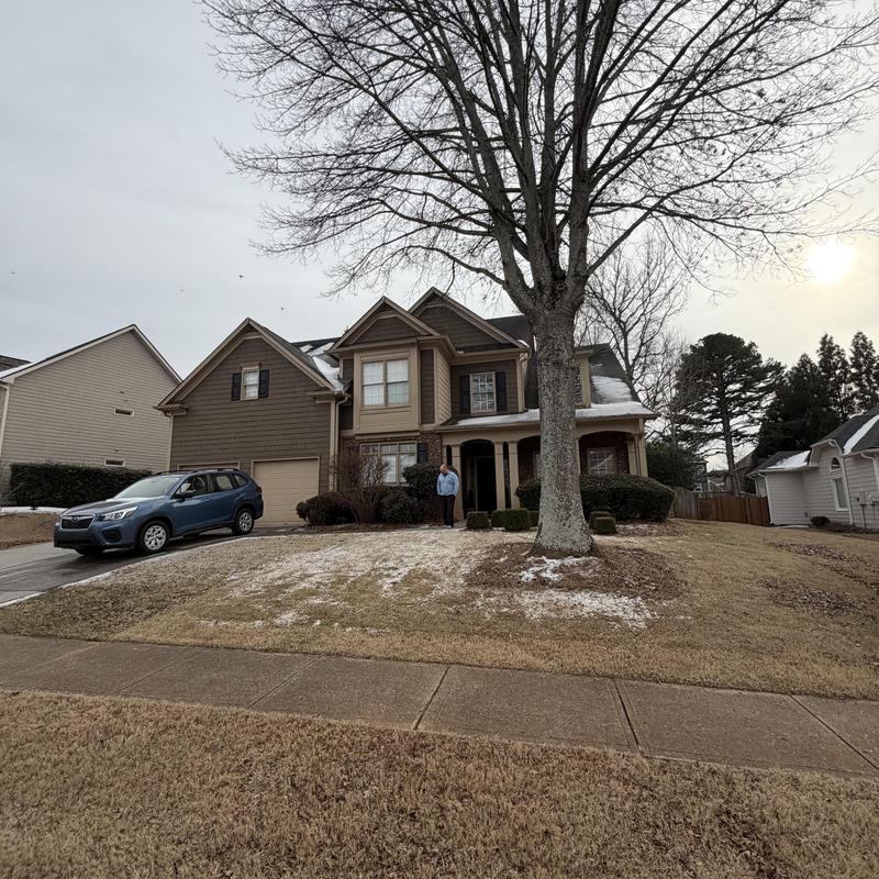 3-tab roof with missing shingles on 3-story house