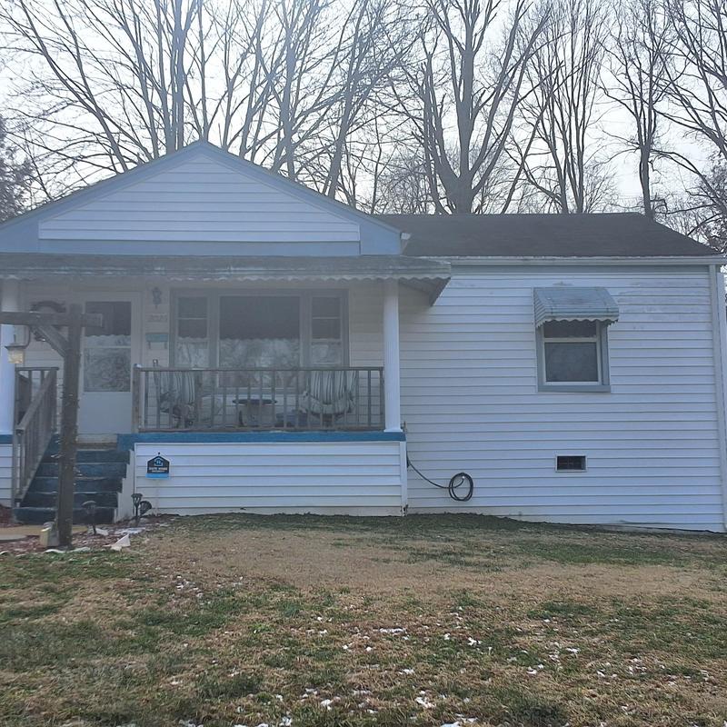 Shingle roof aged with wind damage and leaks