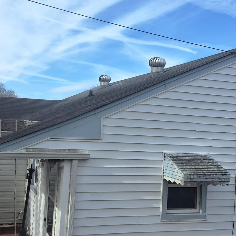 Shingle roof with wind damage and aging leaks