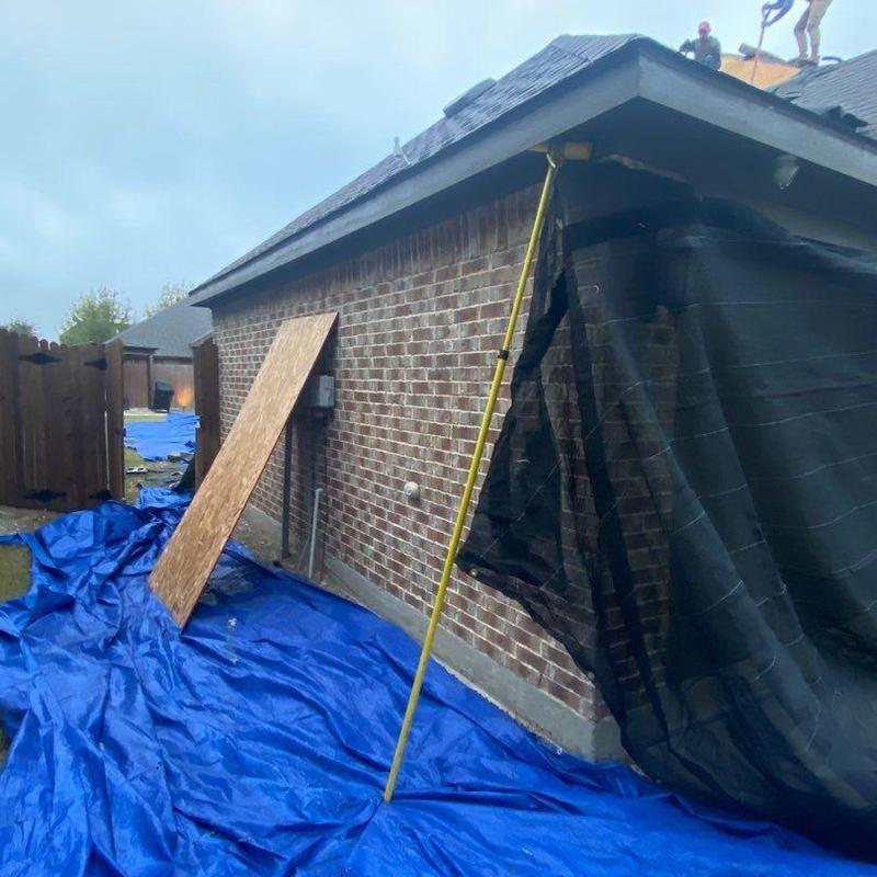 GAF Timberline HDZ roof installation with protective tarps