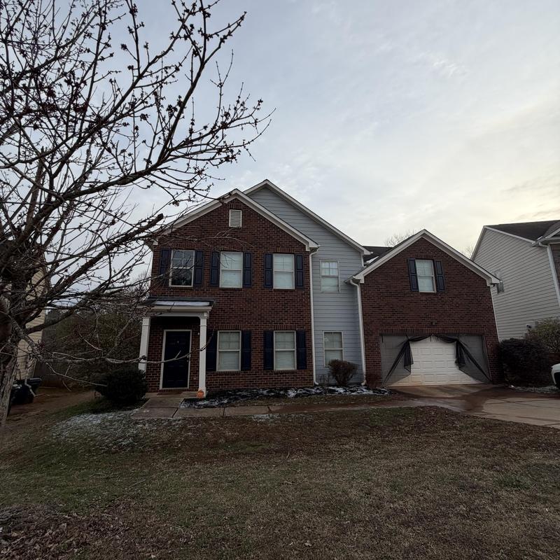 Dead valley roof flashing on two-story brick house