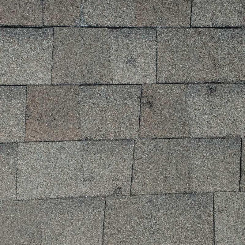GAF Timberline HD shingles with hail damage close-up
