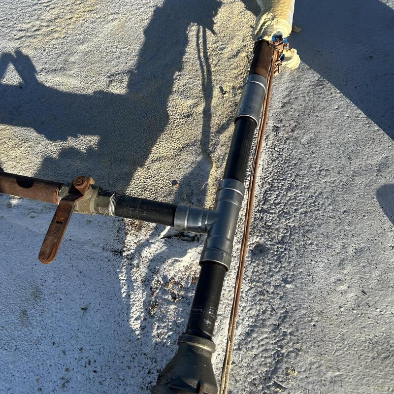 Gas line with T-joint and valve installation on roof